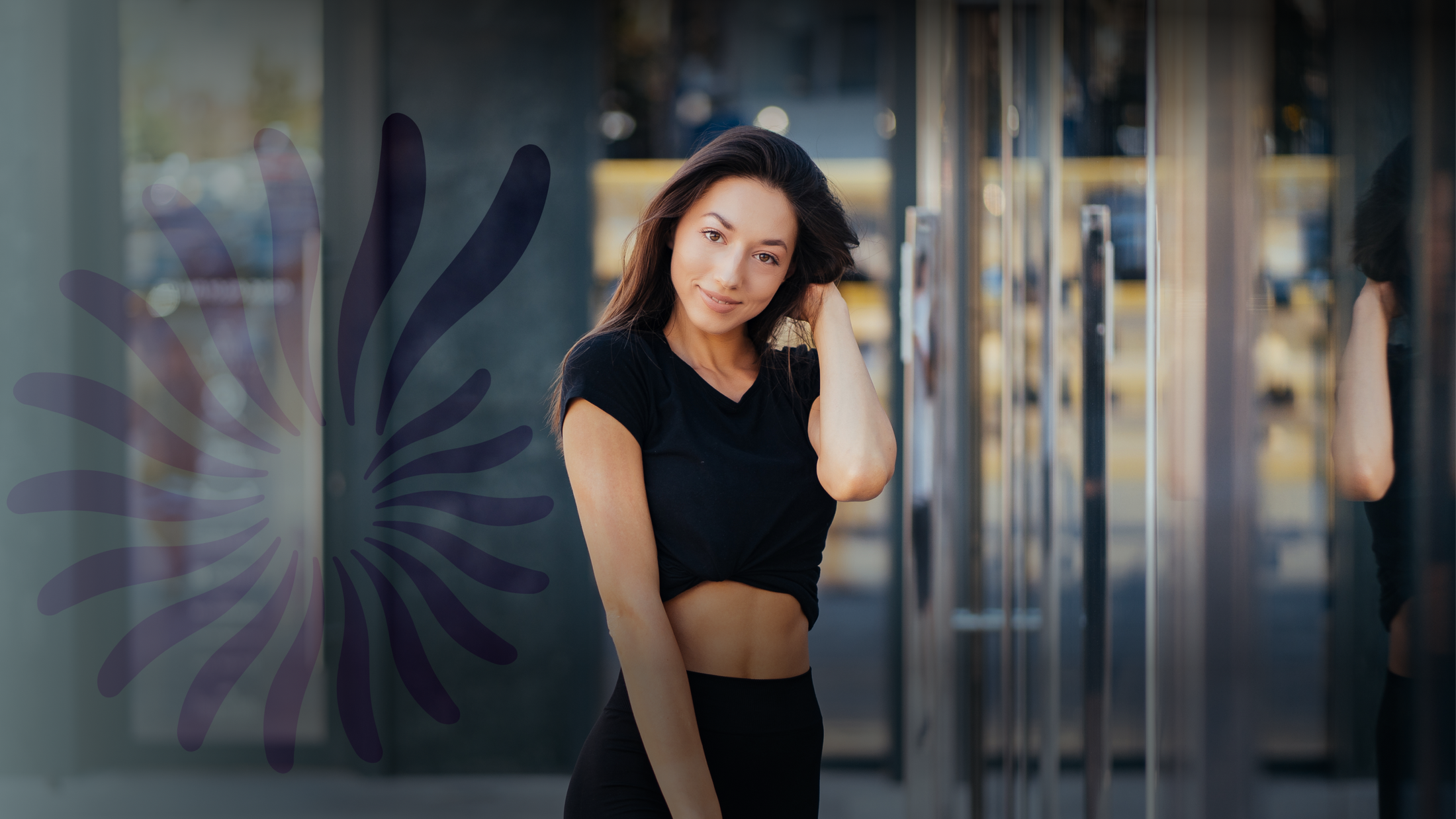 Woman posing outdoors in casual black outfit.